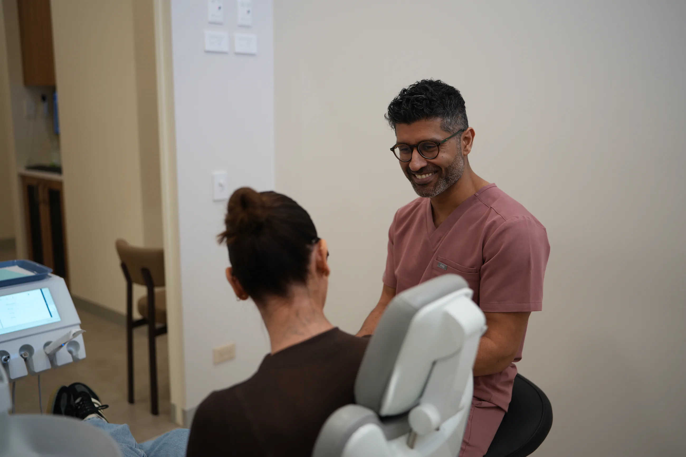 Dentist discussing care options with a Parkwood patient