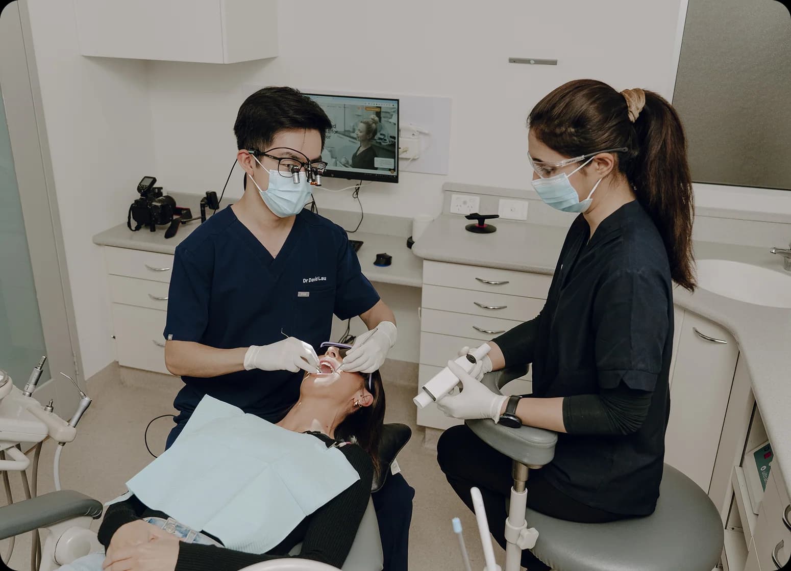 Dental assessment room prepared for reviewing patient records and imaging