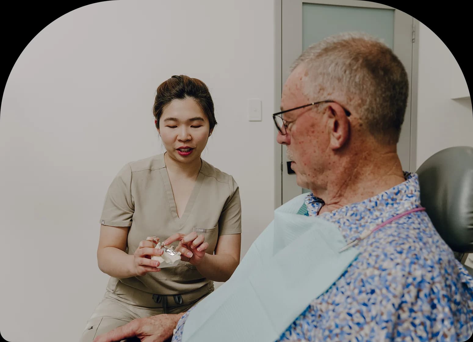A dentist reviewing a treatment plan with a patient