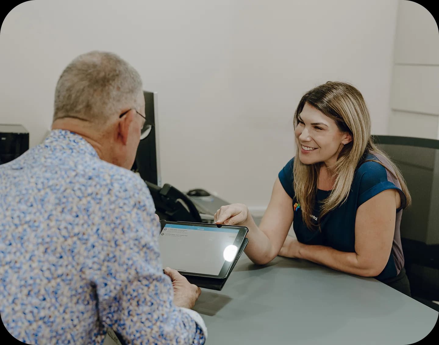 A dental clinician answering patient questions