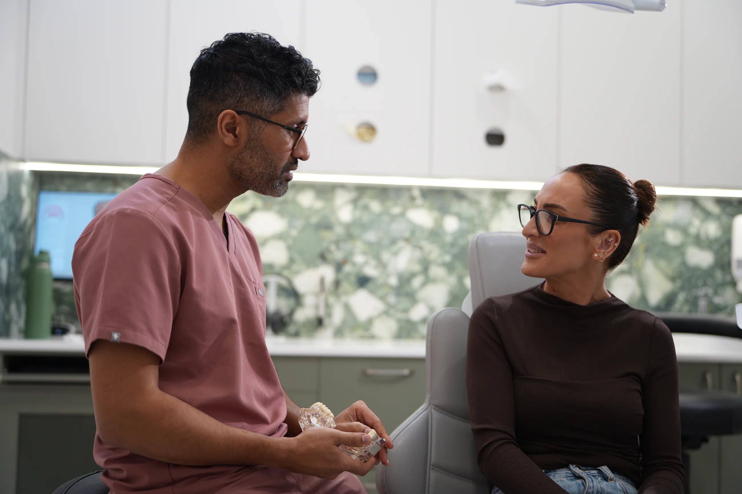 Dental implant planning materials arranged for a patient discussion