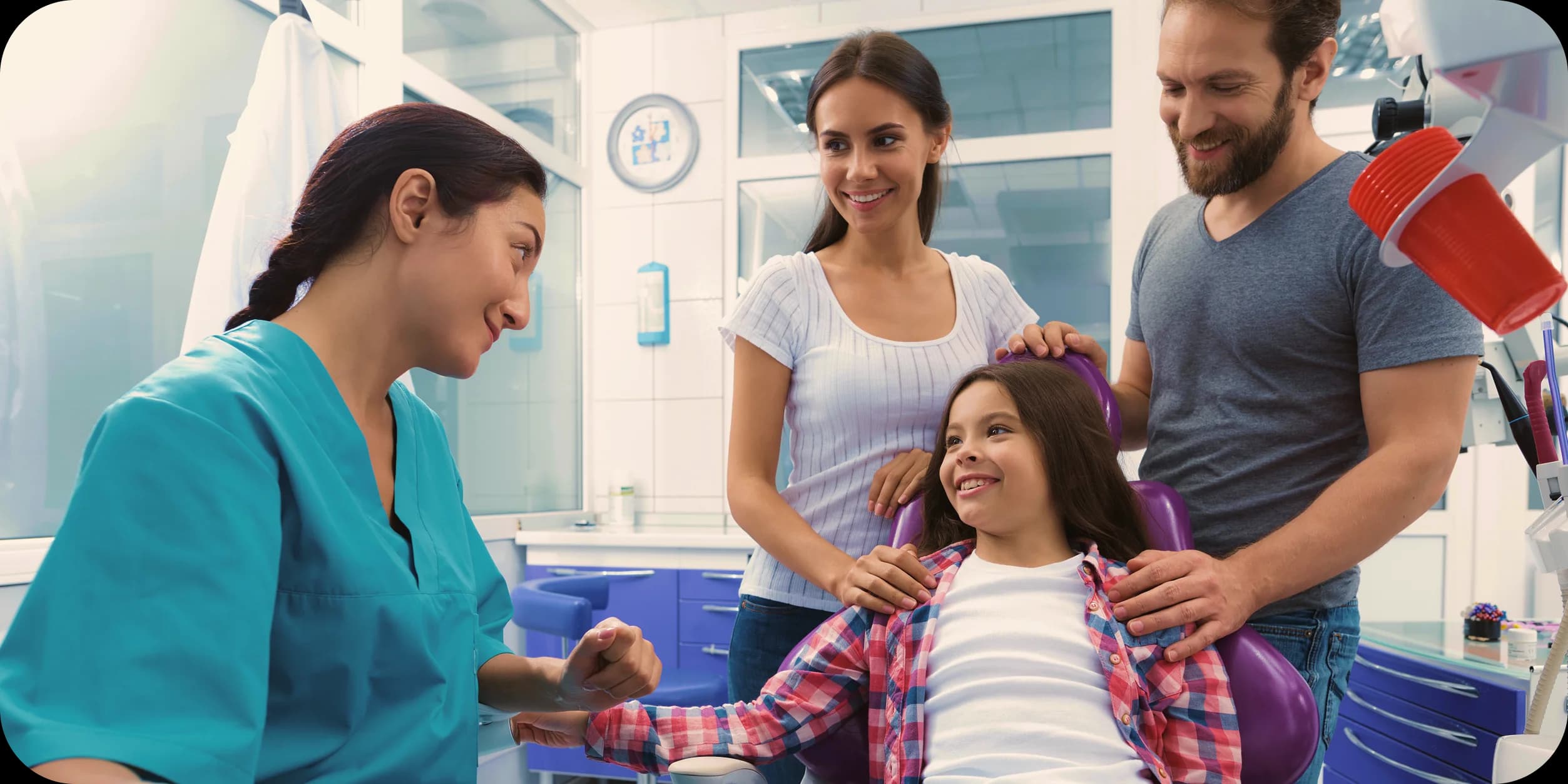 A clinician preparing a treatment room for family dental assessment